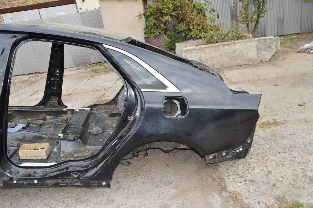 Четверть крыло задняя левая Lincoln MKZ 13- черный цвет UH (04) замята сзади у панели