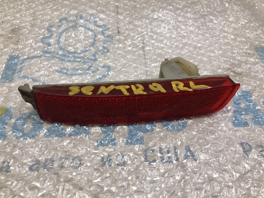 Отражатель зад лев Nissan Sentra 13-19