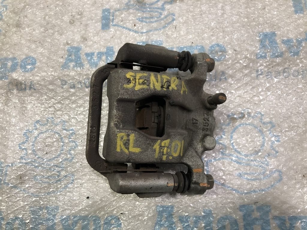 Суппорт зад лев Nissan Sentra 13-19