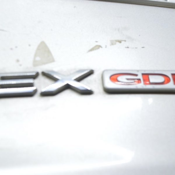 Эмблема надпись крышки багажника Kia Optima 11-15 863102T100