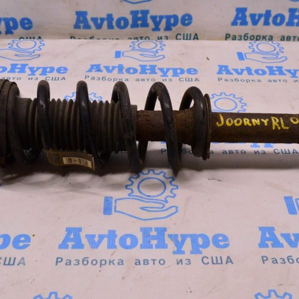 Стойка амортизатора в сборе зад лев Dodge Journey 11- (04) 68068867AC