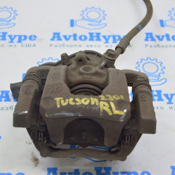 Суппорт зад лев Hyundai Tucson 22- с актуатором 58210CZ600