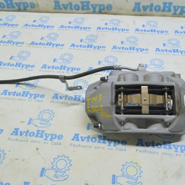 Суппорт передний левый Tesla Model 3 18- без колодок 1044621-00-D