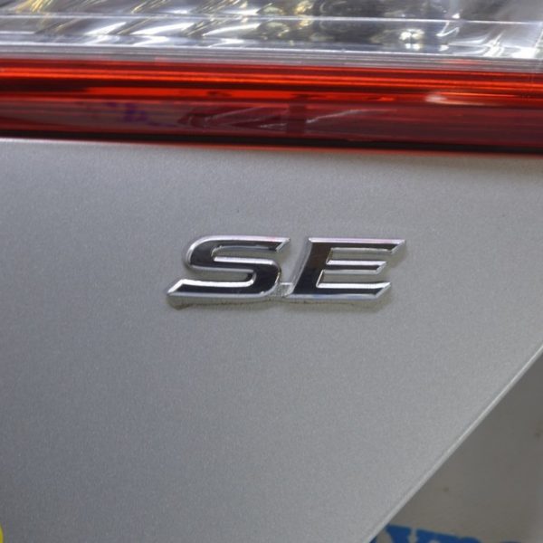 Эмблема SE крышки багажника Toyota Camry v50 12-14 usa 75443-06200